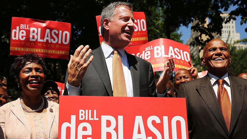 New York Mayor Bill de Blasio on the campaign trail in 2013 with his wife and entertainer Harry Belafonte