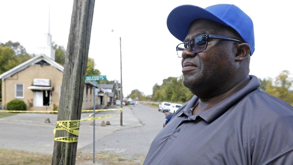 Bishop Clarence Green stands outside his fire-damaged Hopewell Baptist Church in Greenville, Mississippi