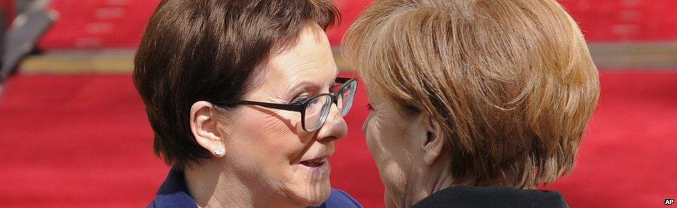 Polish Prime Minister Ewa Kopacz, left, welcomes German Chancellor Angela Merkel