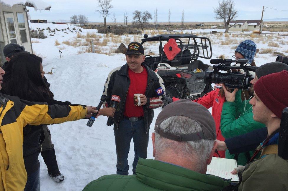 One of the protesters, Duane Ehmer, speaks to the media