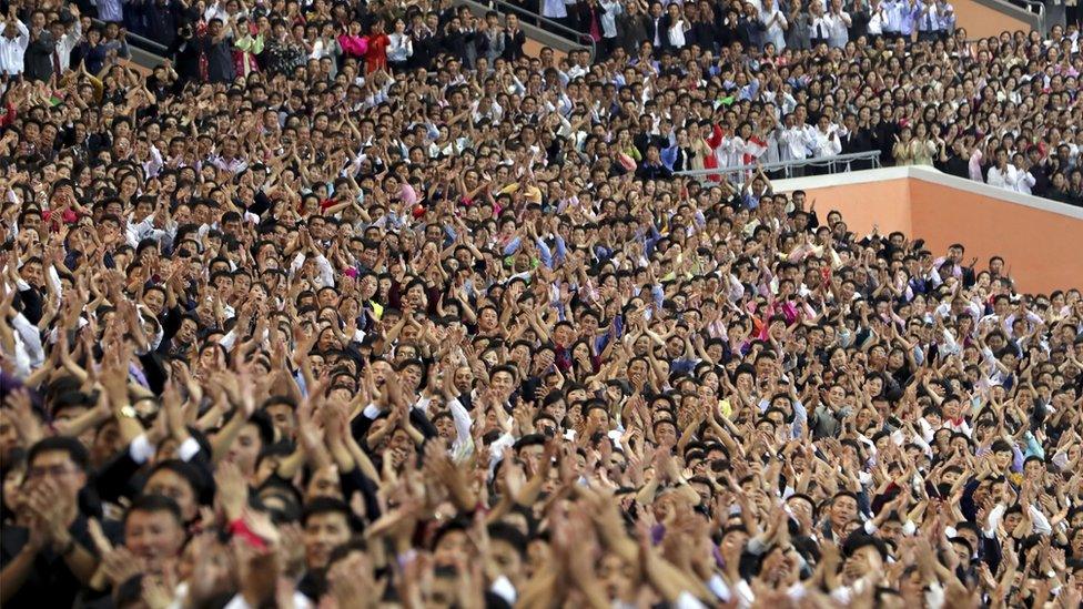 North Koreans cheer for South Korean President Moon Jae-in and North Korean leader Kim Jong Un at the May Day Stadium on September 19, 2018 in Pyongyang