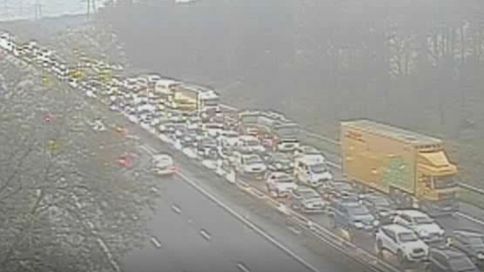 M56 closes after crash, causing long delays for morning commuters - BBC ...