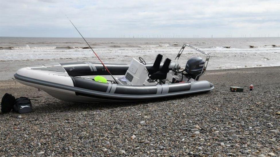 A police photograph of the grey inflatable boat on the shore at Easington