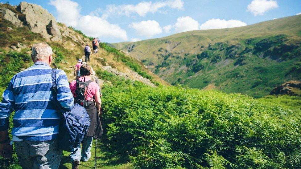 People on a guided walk in the Lake District