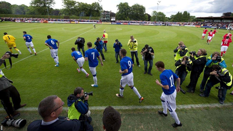 Rangers run on to Brechin City's Glebe Park for their first match since liquidation