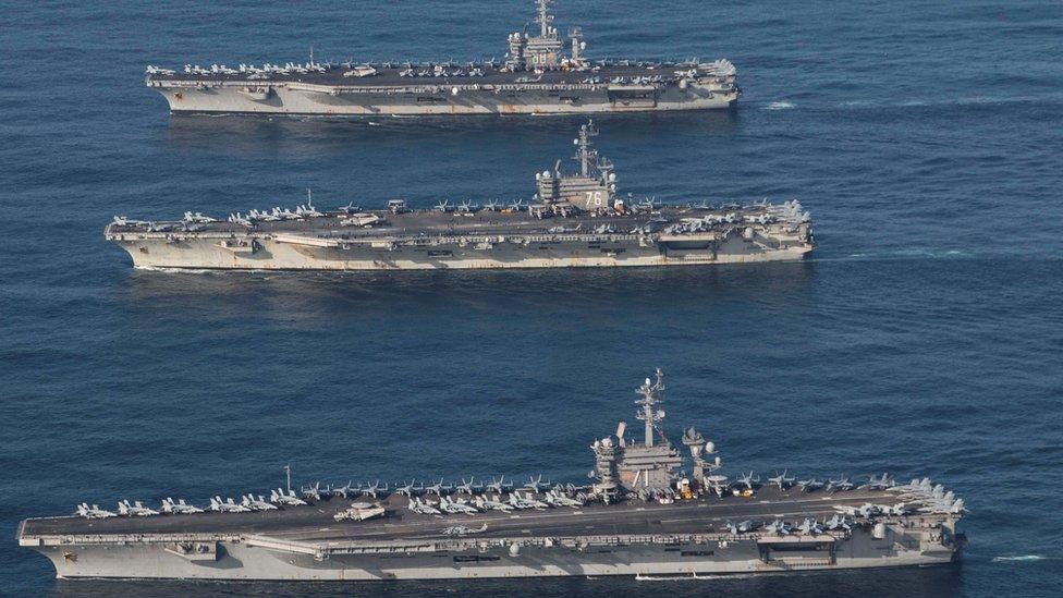 The aircraft carriers USS Ronald Reagan (CVN 76), USS Theodore Roosevelt (CVN 71) and USS Nimitz (CVN 68) in the western Pacific, 12 November 2017