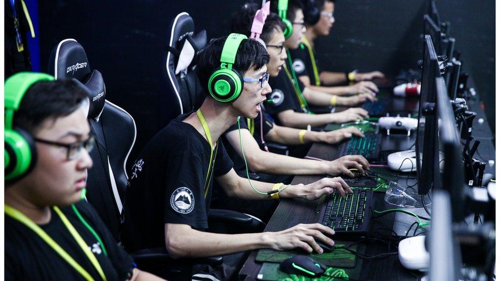 Students from T-DT Innovation Lab of Northeastern University compete against Jiaolong of Shanghai Jiao Tong University during 2019 RoboMaster Robotics Competition Final Tournament champion match at Bao'an Stadium on August 11, 2019 in Shenzhen, Guangdong Province of China