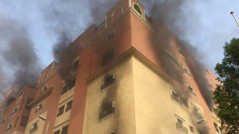 Smoke billows from a fire at a residential complex used by state oil giant Saudi Aramco in Khobar, Saudi Arabia, 30 August 2015