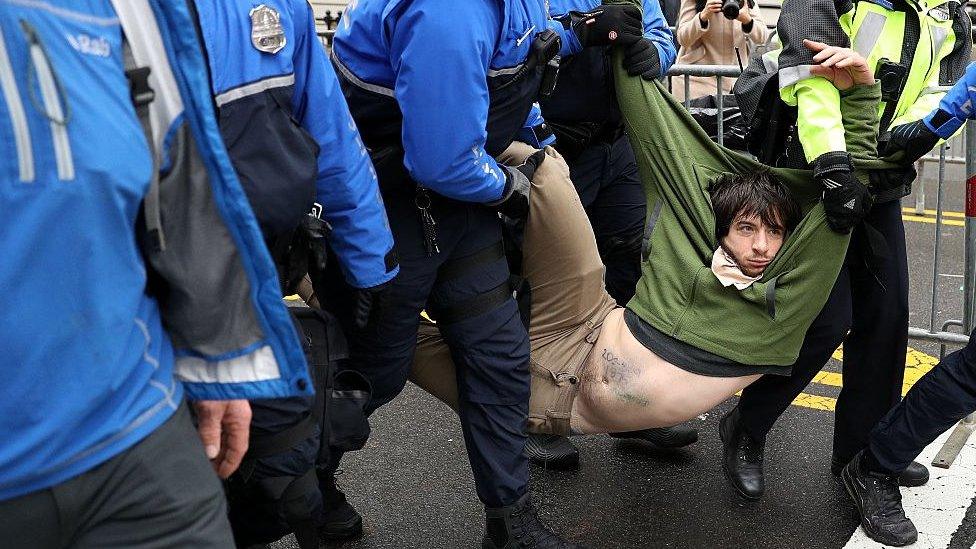 Protester dragged away from public access point to National Mall