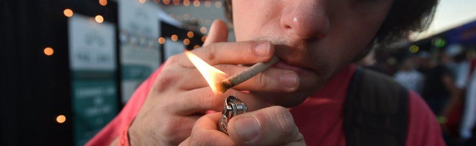 File photograph of a man smoking marijuana