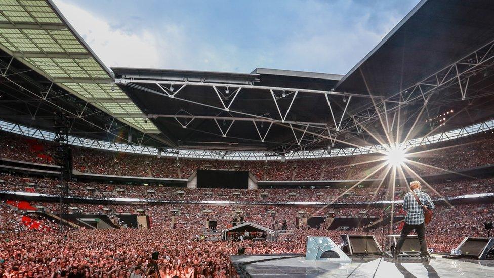 Ed Sheeran performing at Wembley Stadium in 2015