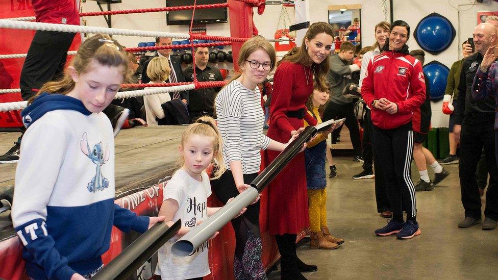 Kate took part in a teamwork exercise holding sections of a pipe and steered a small orange ball from one end to the other