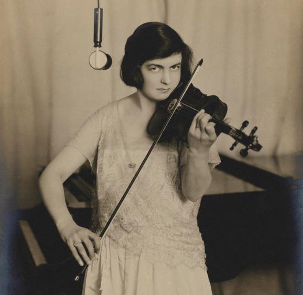 Violinist Isolde Menges at the microphone, broadcasting from the radio station 2ZY