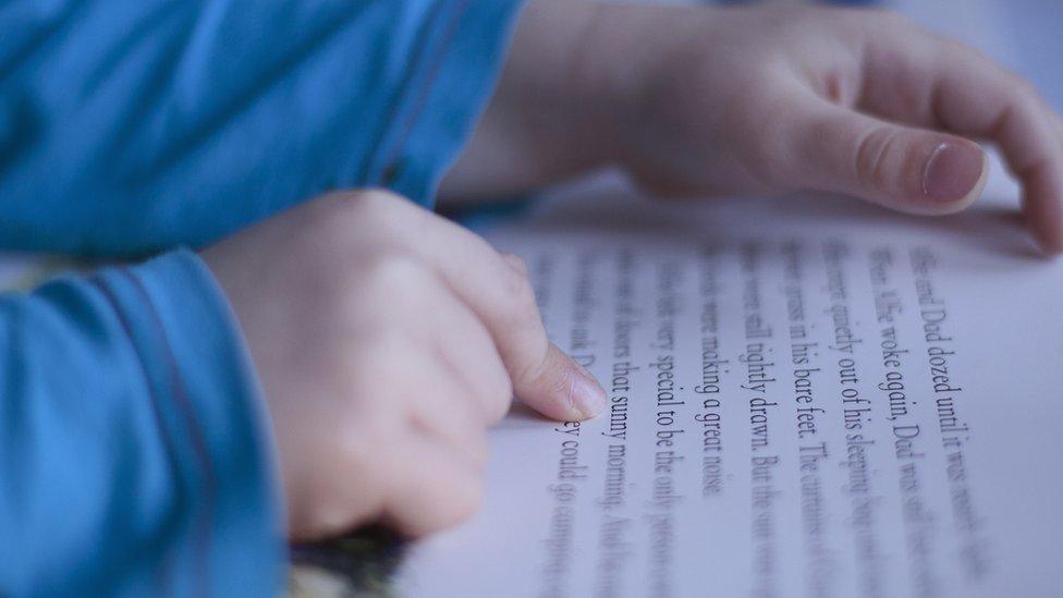 Stock image of child reading