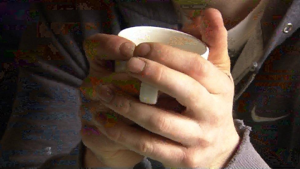 Hands on a mug