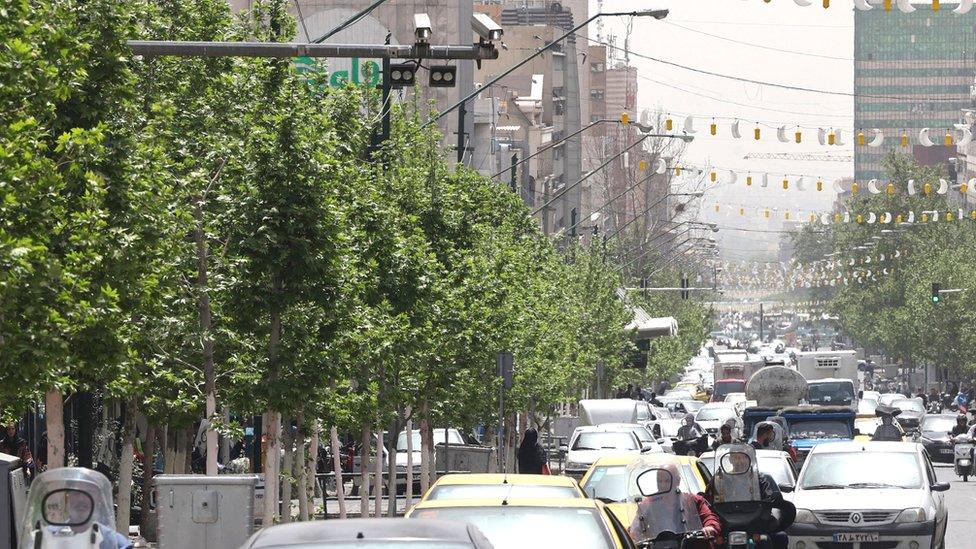 Closed-circuit television (CCTV) cameras are pictured in a street in Tehran on April 10, 2023