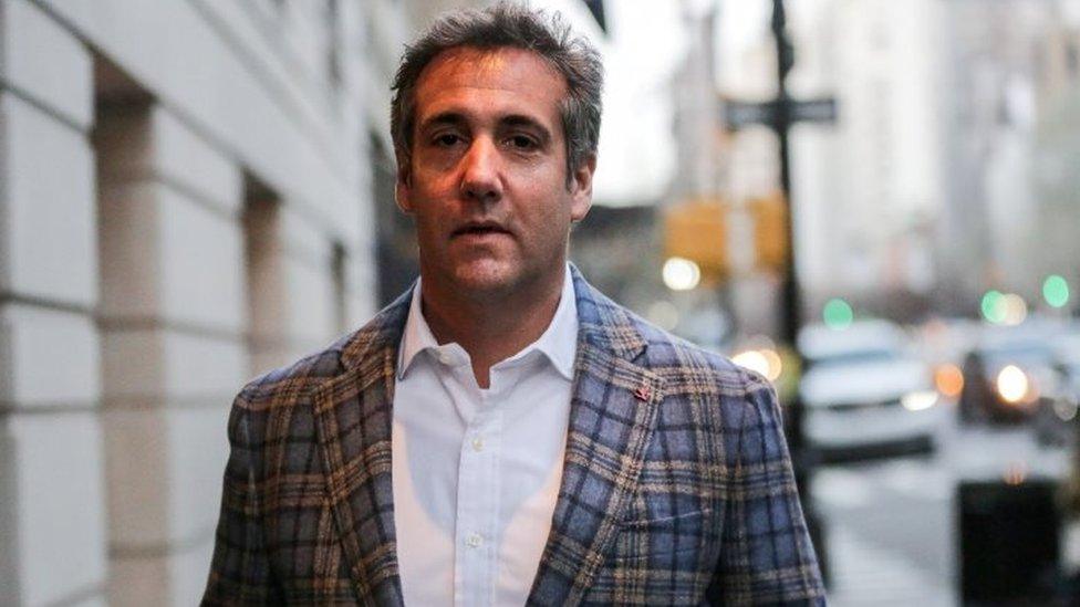 US President Donald Trump's personal lawyer Michael Cohen exits a hotel in New York City.