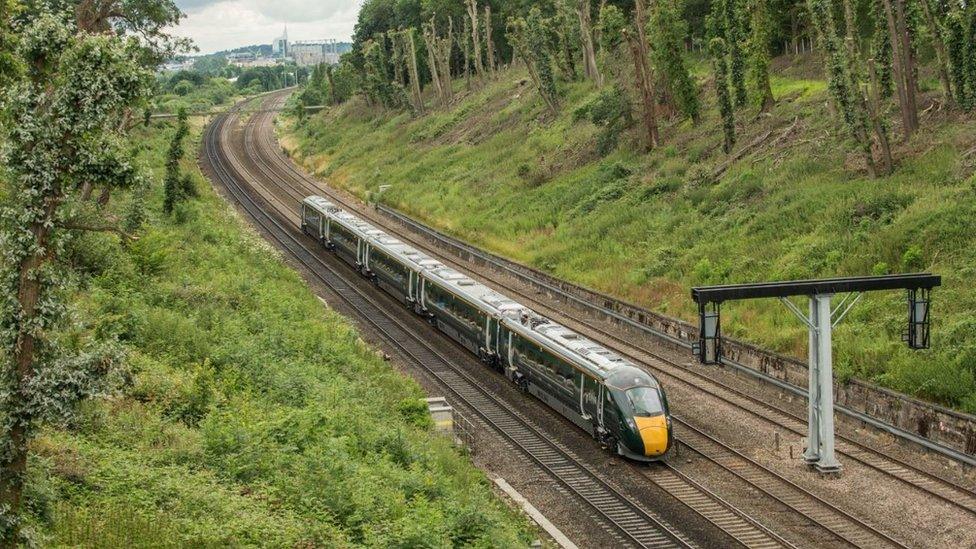 Photo of a GWR train with a city in the background