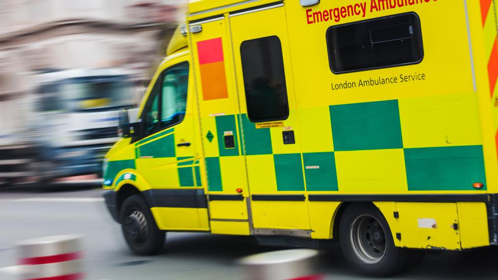 Ambulance driving through a street