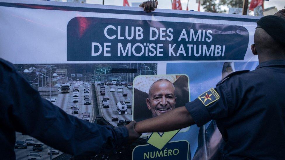 A poster of the "Friends of Moise Katumbi", one of the main opponents of President Felix Tshisekedi, is held during Katumbi's election rally in a stadium in Goma, one of the largest cities in the east of the Democratic Republic of Congo, on November 23, 2023.