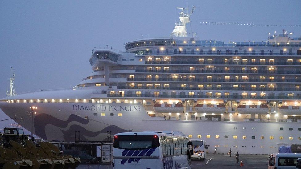 Buses parked close to the Diamond Princess cruise ship