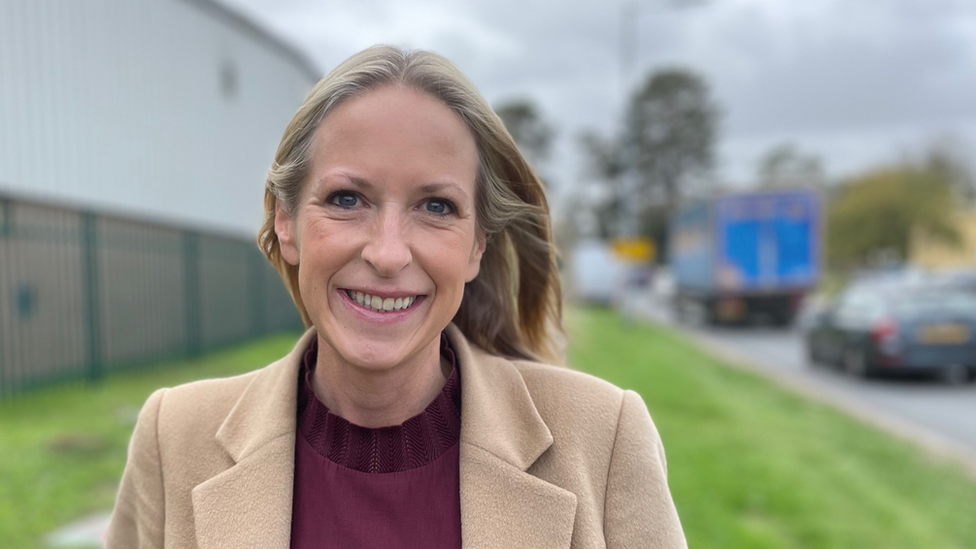 Beckie Brown, standing by the side of the road in Newmarket