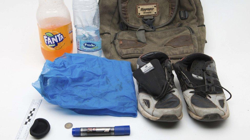 two bottles, pair of shoes, rucksack and coins