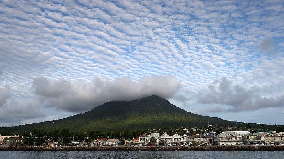 Cloud formations over a volcanic peak on Nevis, St Kitts and Nevis