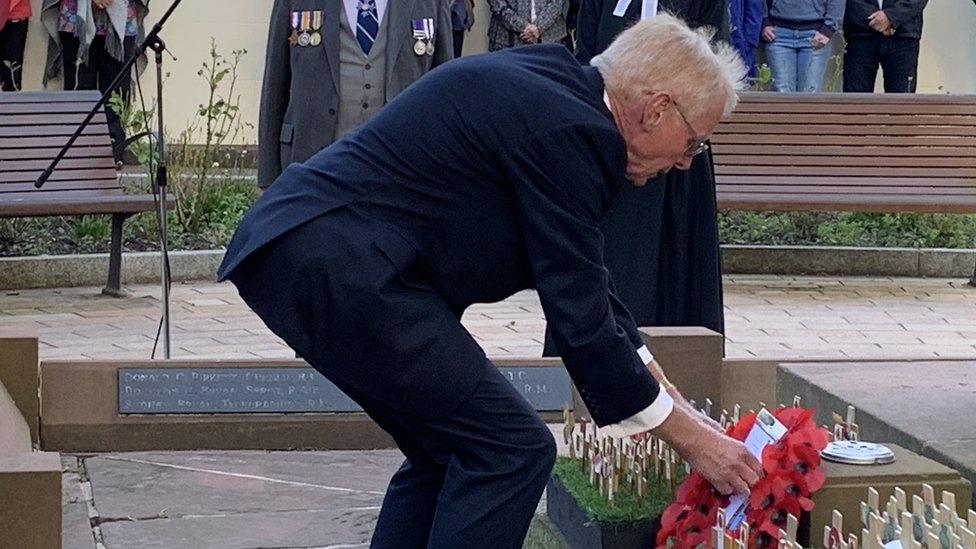 Lieutenant Governor Sir Richard Gozney laying a wreath