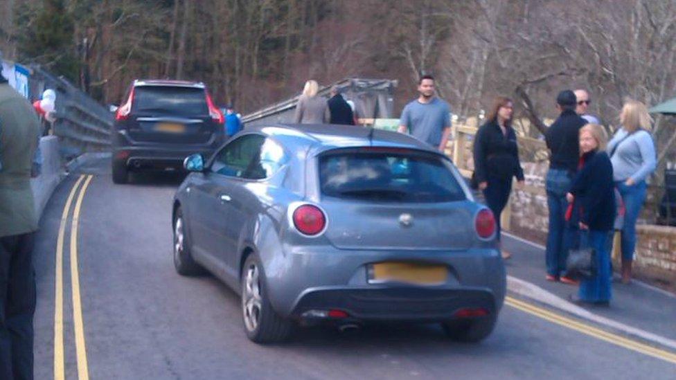 Cars crossing the bridge