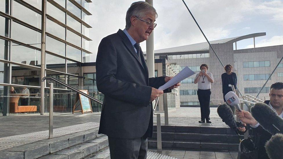 Mark Drakeford speaking on the Senedd steps