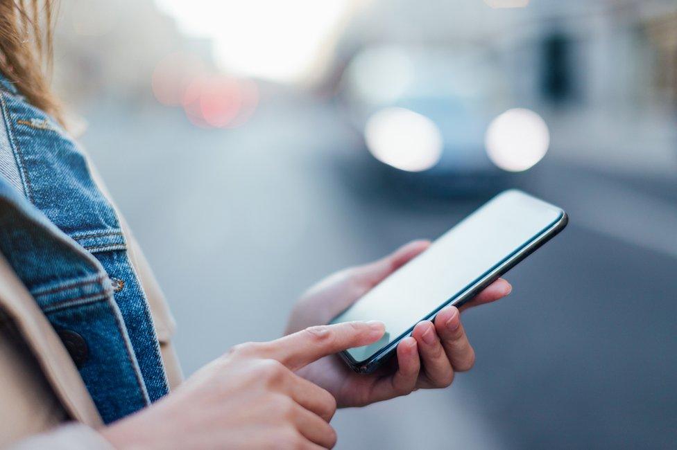 Woman holding phone