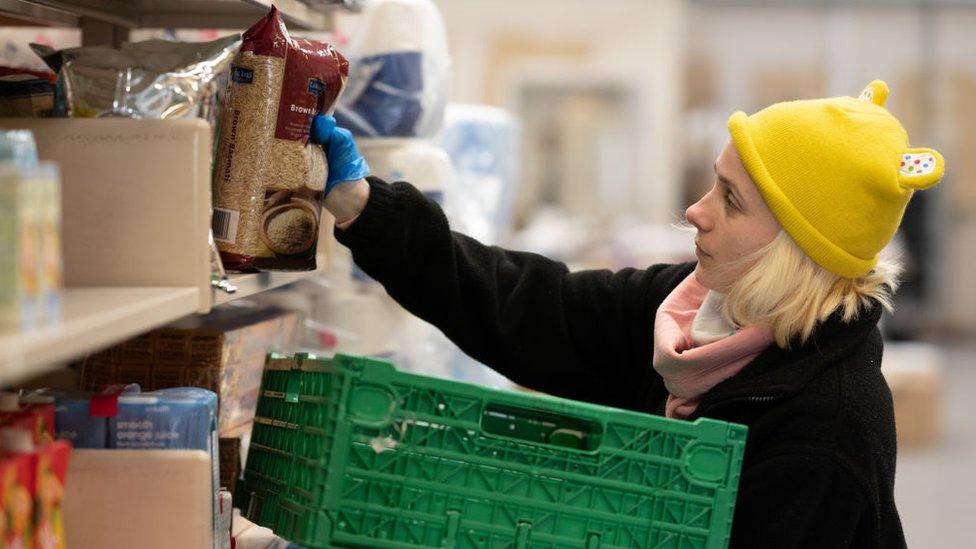 Woman preparing a food parcel