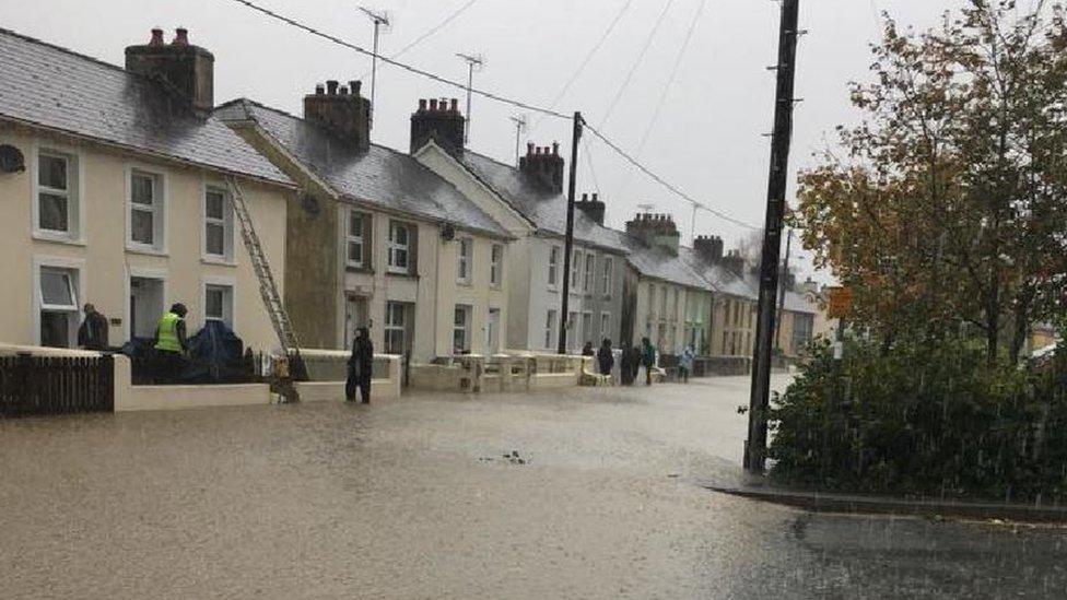 One of the main streets in Llanybydder, Carmarthenshire, has been hit by flooding