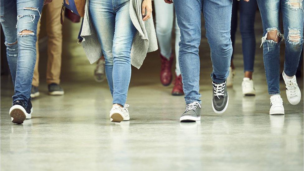 Students walk in corridor