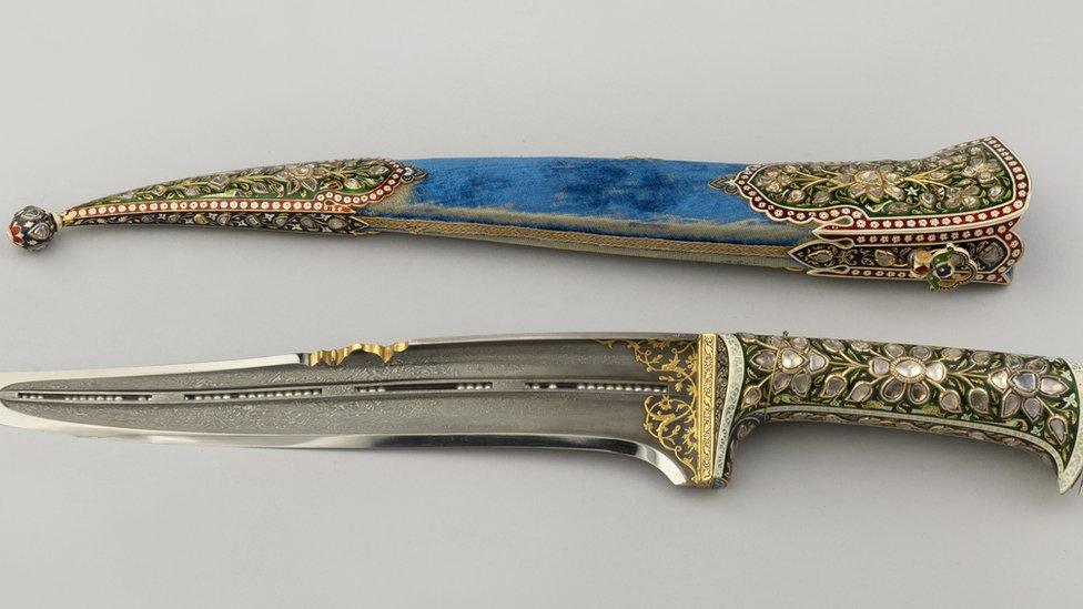 Ornamented dagger, presented by Mangal Singh, Maharaja of Alwar, with an enamelled and bejewelled handle and a scabbard with a blade filled with loose seed pearls.