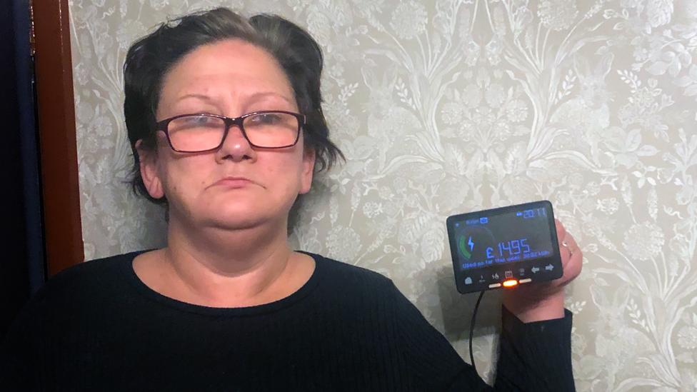 Michelle Dearden holds her smart meter