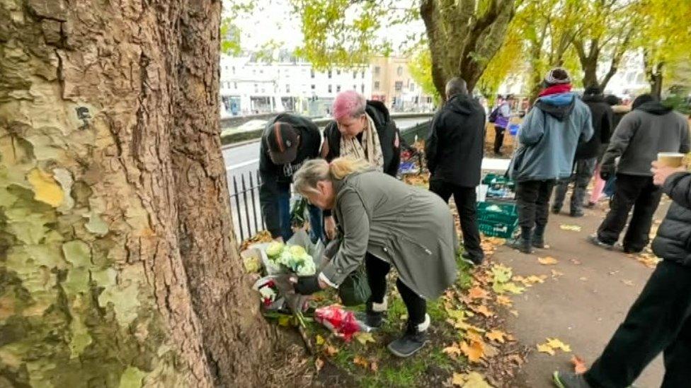 Patricia Gaydon visiting memorial