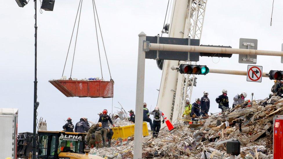 Search and Rescue teams look for possible survivors in the partially collapsed 12-story Champlain Tower