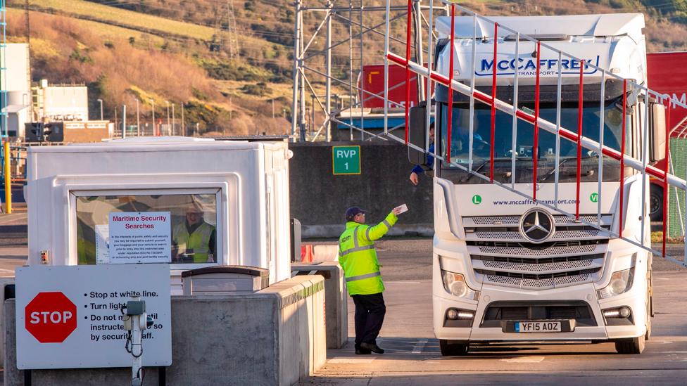 A lorry passes through security at the Port of Larne in Co Antrim, Northern Ireland on December 6, 2020.