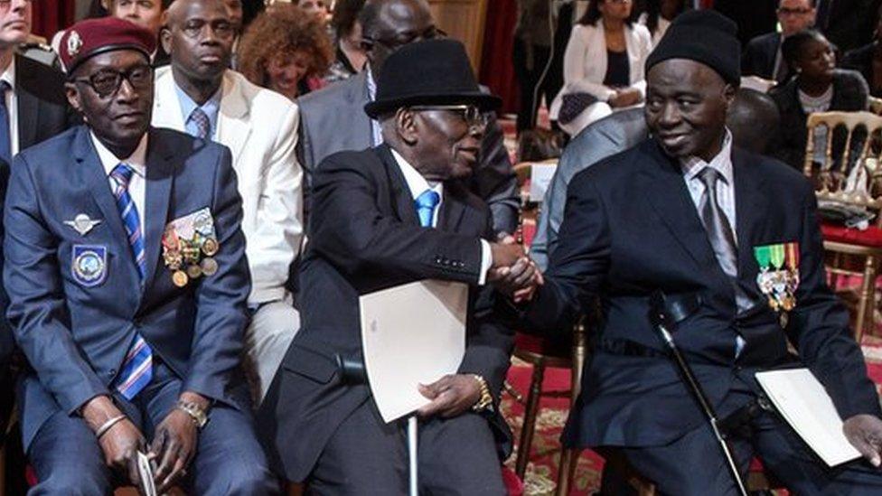 African war veterans at a citizenship ceremony in France