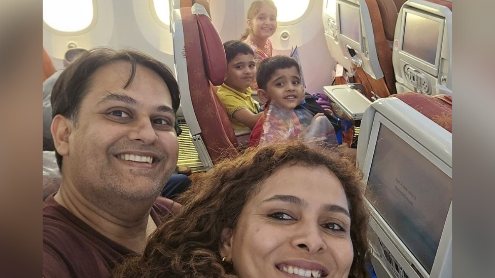 Dr Prateek Joshi his wife and three children on the plane