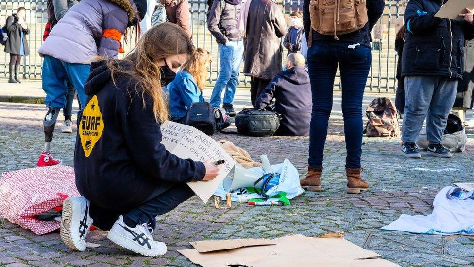 Image shows a student at a protest on Monday