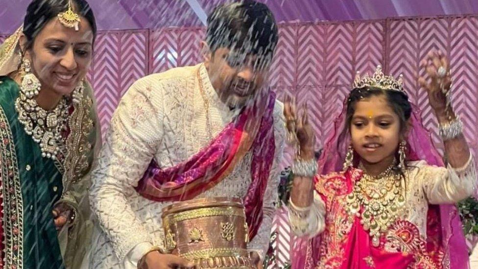 Devanshi with her parents Dhanesh and Ami Sanghvi at the ceremony