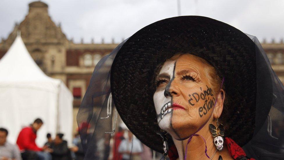 A protester with face paint saying "Where are they?" in reference to the missing 43 Ayotzinapa students