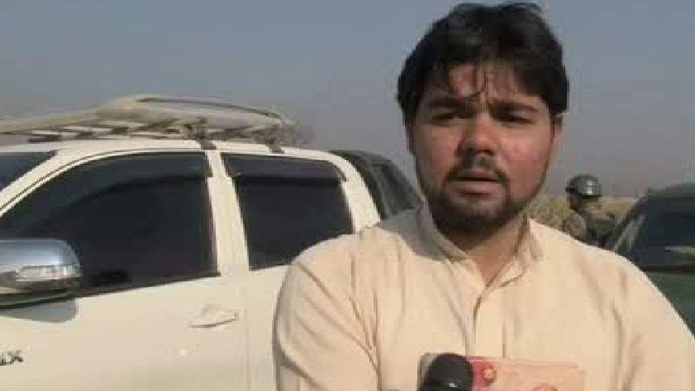 Distressed-looking man speaking to camera