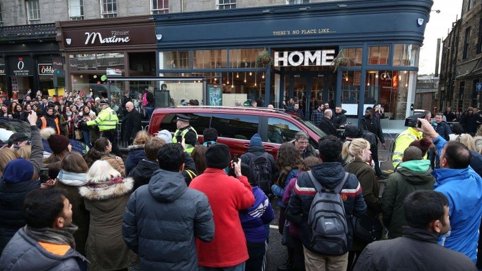 crowd outside home