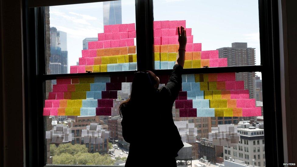 Rainbow made from sticky notes on window