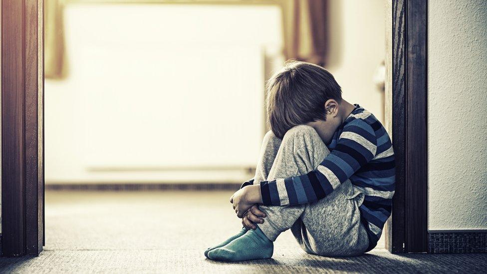 Child sitting on floor