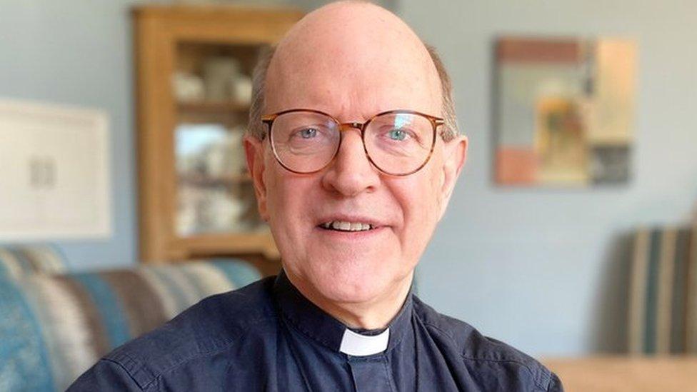 Martin Seeley, the Bishop of St Edmundsbury and Ipswich, sitting in his home